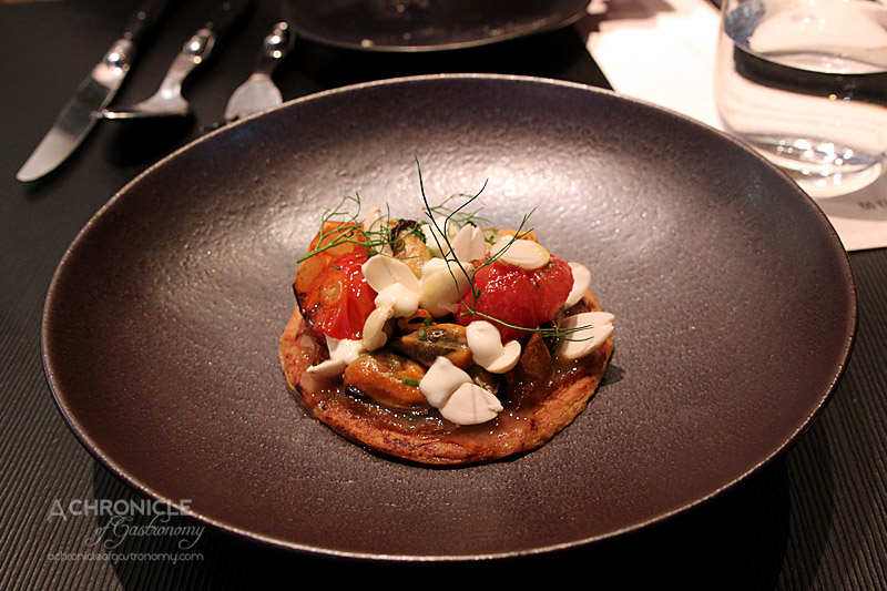 The Roving Marrow - Sea Bounty Mussel Tart, Almonds and Tomatoes ($16)
