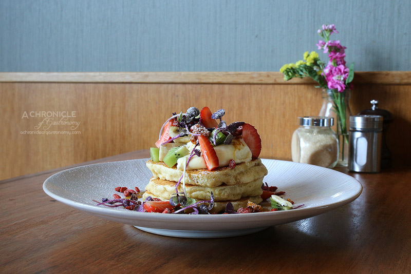 Rock Paper Scissors (32) Buttermilk Pancakes with grilled banana, strawberries, shaved honeycomb, kiwi fruit, double cream, maple syrup ($17.50)