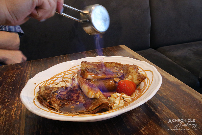 Stokers - Banana Flambe Pancakes served with banana filling and caramelised bananas drizzled with flaming Vanilla & Lime Spice Rum ($18.90)