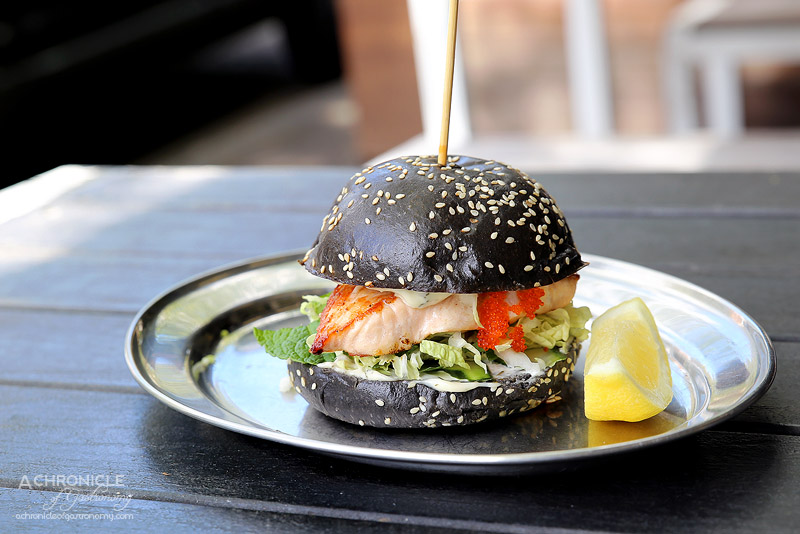 Tank Fish and Chips - Grilled salmon, lemon and dill may, mint and cucumber slaw on a squid ink brioche bun