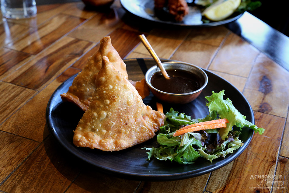 Jai Ho - Samosa - Homemade pastry filled with spiced potatoes, green peas, fresh tempered spices and coriander ($7.50)