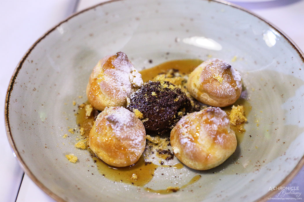 Watts Cooking - Profiteroles with vanilla cream, chocolate mousse and mandarin & Cointreau sauce ($12.50)