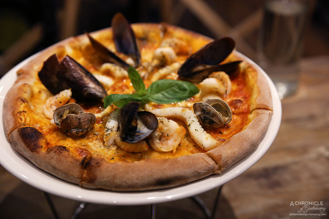 Rubicon - Marinara Pizza - San Marzano tomato, mozzarella cheese, tiger prawns, Hervey Bay scallops, mussels, pippies calamari, garlic oil, oregano, fresh basil ($24.50)