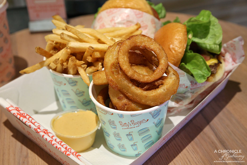 Betty's Burgers - Beer battered onion rings ($6) French fries w sea salt ($5)