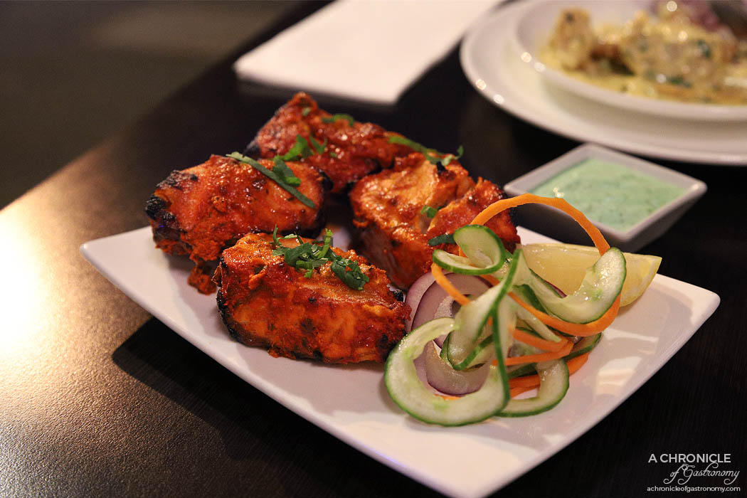 Curry Smuggler - Salmon Tikka - Fillet marinated in tandoori spices and yoghurt and cooked in the tandoori oven ($21)