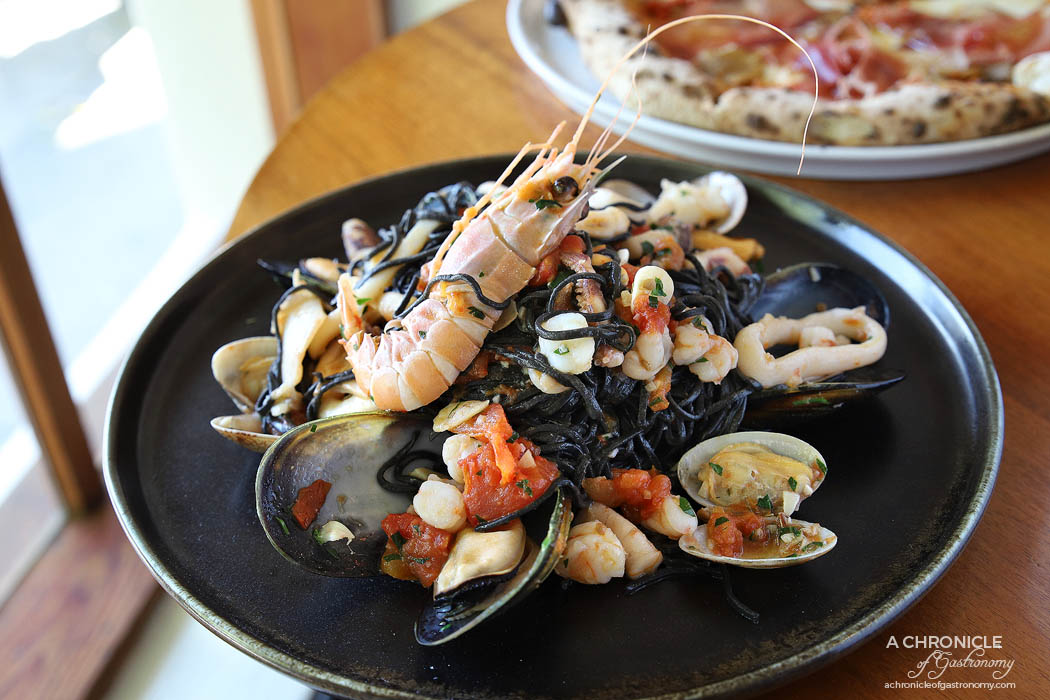 Il Caminetto - Black taglioni alla pescatora - Black ink homemade pasta w calamari, prawns, scampi, vongole, mussels and garlic, served with fresh tomato sauce ($29)