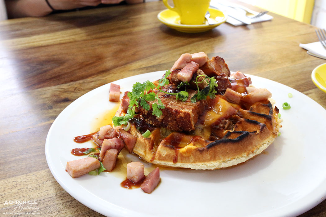 Two Little Pigs - Loaded Waffle - BBQ pulled pork waffle wtih grilled cheddar, maple bacon pieces, pork crackle, spring onion adn house made maple BBQ ($19.90)