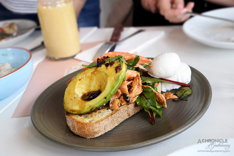 Punchbowl Canteen - Avocado on toast with blackbean dressing, house tea-smoked trout, poached egg ($19.50)