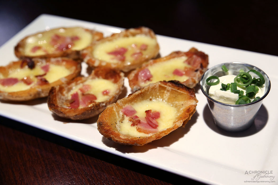 TGI Friday's - Loaded Potato Skins - melted cheddar cheese, bacon with sour cream and green onions (6 for $16)