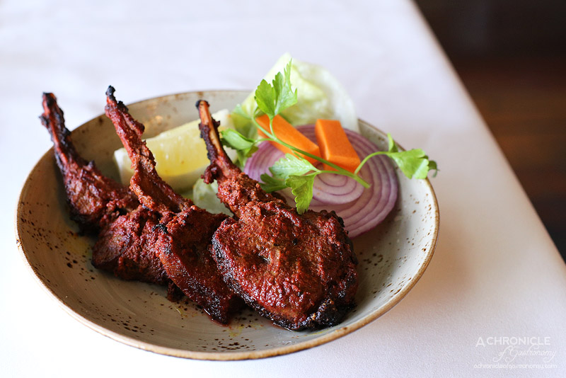 Bhoj - Hoshiarpuri Champaan - Hot lamb cutlets marinated in malt vinegar, cumin powder and medium spices, barbequed, finished with tangy sauce (3 for $16.50)