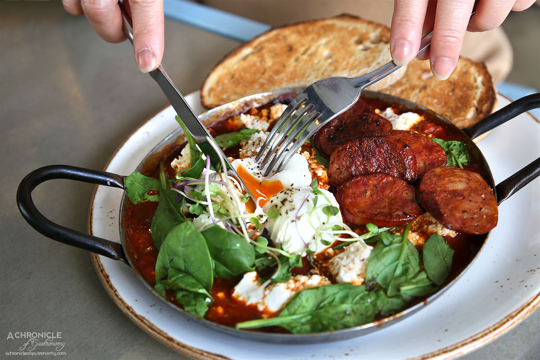 Neon Tiger - Shakshouka w poached eggs, spicy tomato sauce, spinach, peppers, fresh chilli, basil and feta, toast + chorizo ($16+4.30)