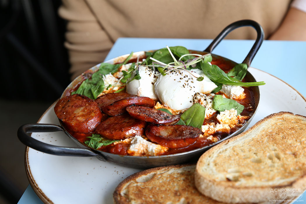 Neon Tiger - Shakshouka w poached eggs, spicy tomato sauce, spinach, peppers, fresh chilli, basil and feta, toast + chorizo ($16+4.30)