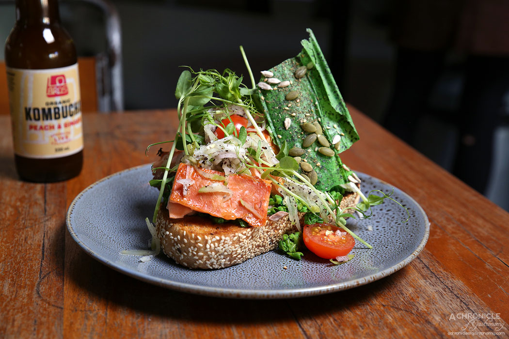 El Mirage - Smashed Peas on seeded grain toast w hot smoked salmon, poached eggs and apple and fennel salad ($18.50)
