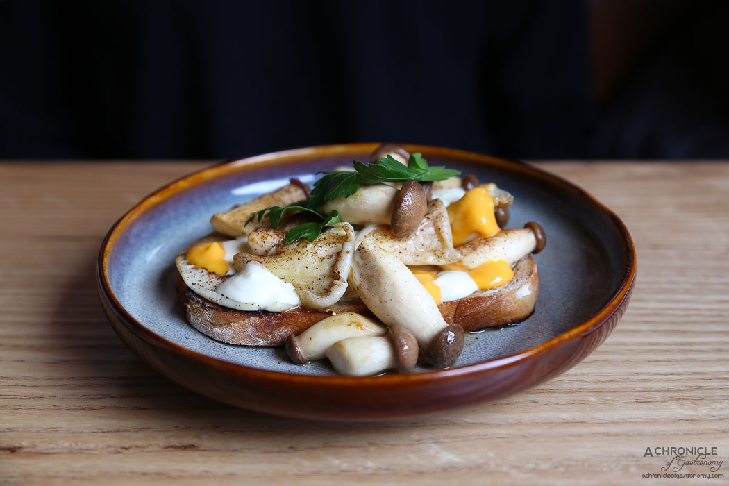 Nomada Cafe Y Tapas - Sauteed mushrooms on sourdough, cured yolk, fresh curd ($17)