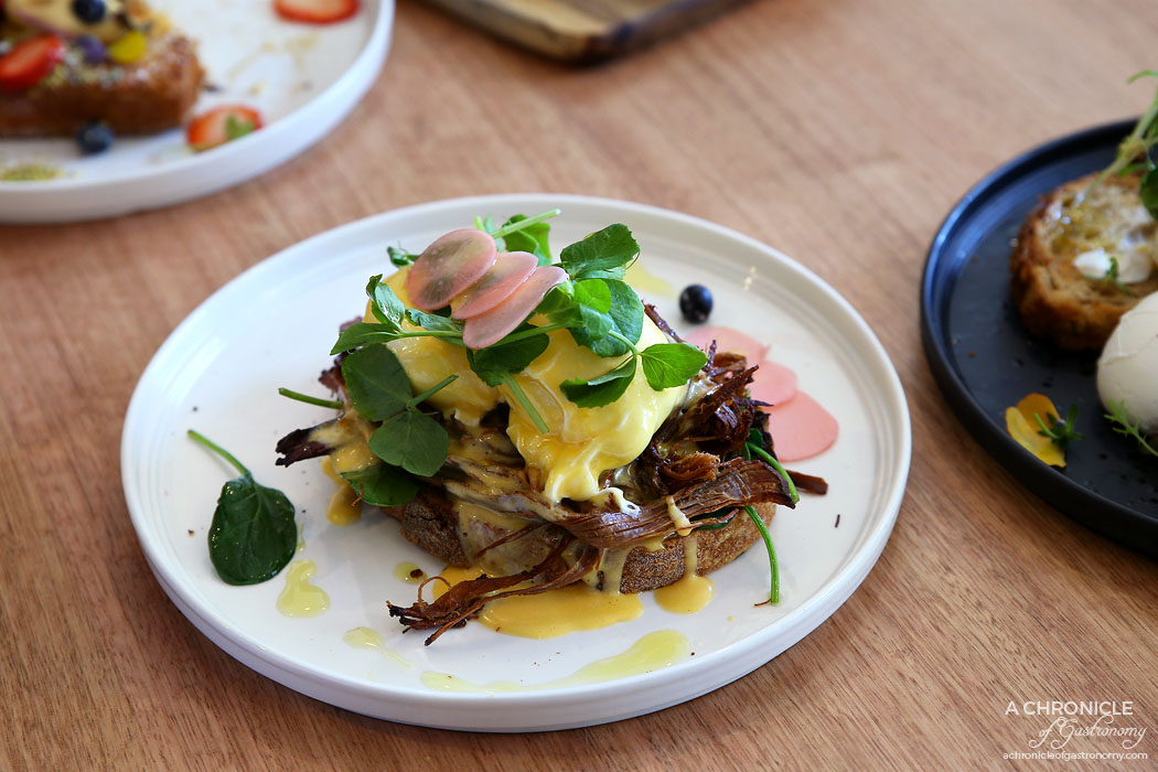 Proud Sprout - Pulled Beef Brisket Benedict - Slow-cooked beef brisket, wilted spinach, poached eggs, hollandaise, pickled radish ($17)
