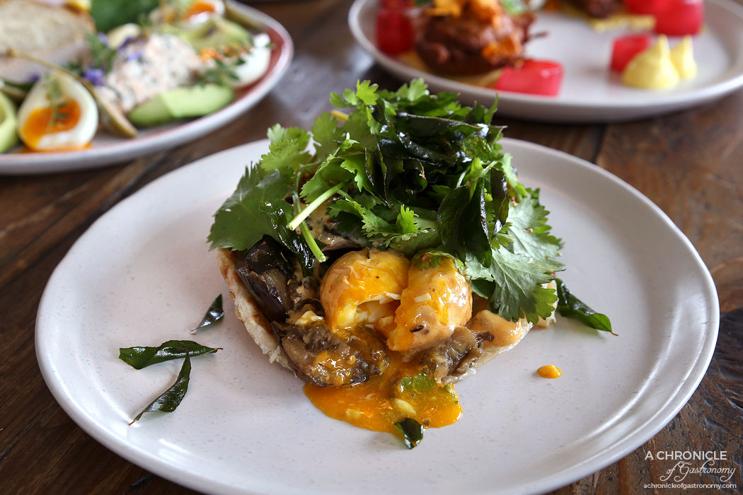 Addict - Son In Law Eggs Benedict - Smoked eggplant, tom yum hollandaise, fried onion, coriander, curry leaf and roti ($18)