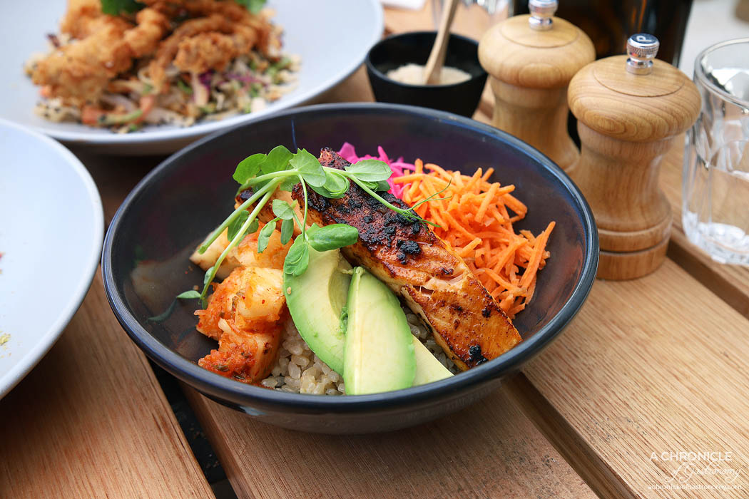 Stanley - Sriracha Salmon Flora Bowl w brown rice, pineapple, kimchi, pickled red cabbage, edamame, shredded carrot, avocado with miso dressing ($19.50)