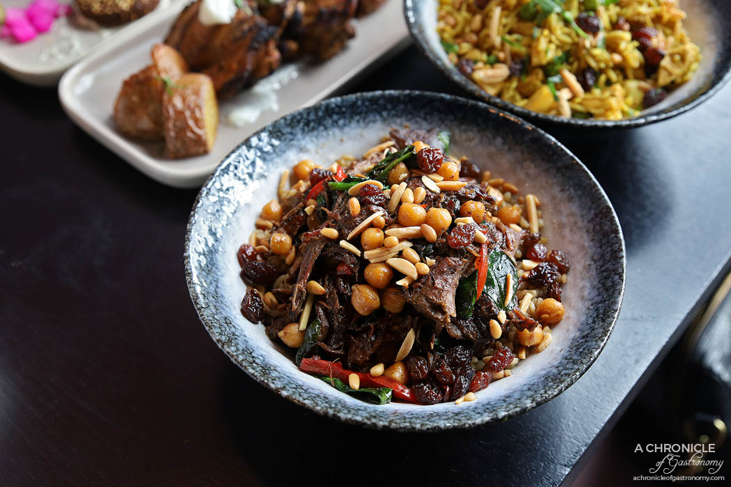 Mama Rumaan - Qouzi - Slow cooked lamb shoulder, pomegranate, traditional herbs and spices, wheat and chickpeas (small, $19)