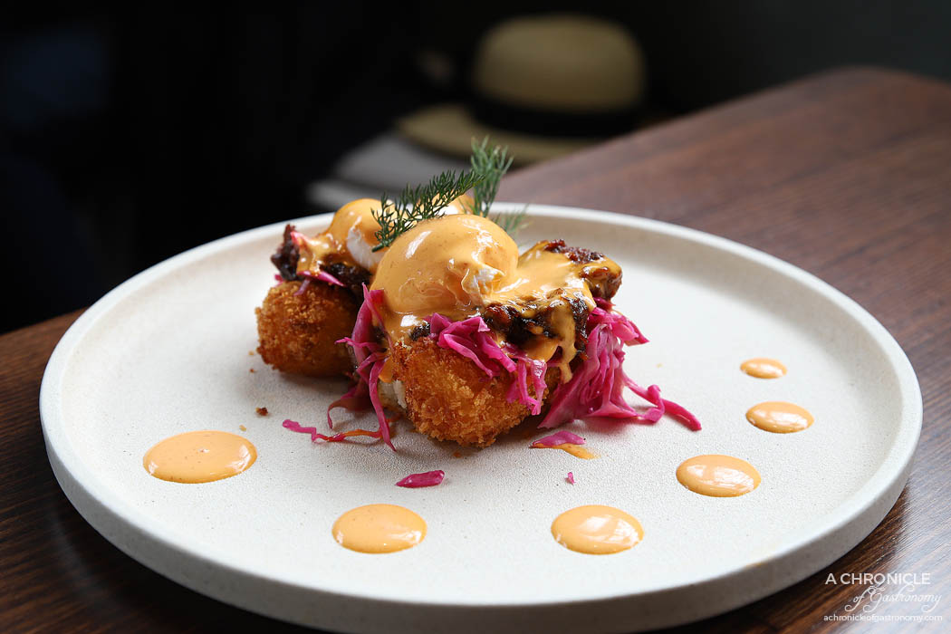 Cafe Louis - Benny - Pulled pork with pickled cabbage, poached eggs and sriracha bernaise on croquettes ($19.50)