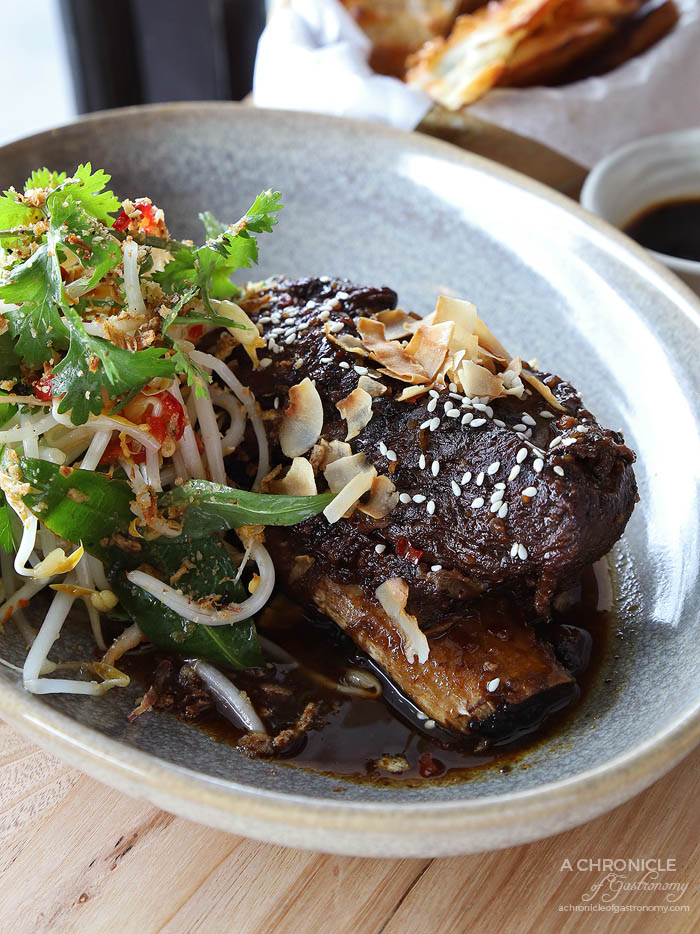 Tora - Chilli Caramel Beef Ribs - Thai shoot salad, nuoc mam dressing, toasted coconut ($23)