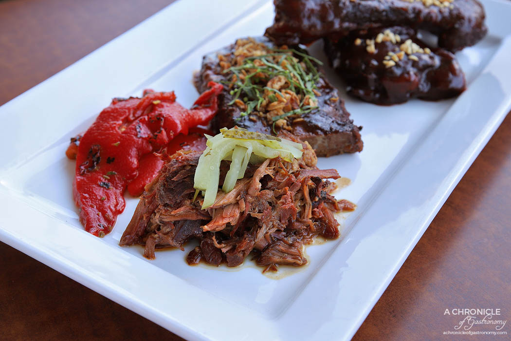 Bluestone American BBQ - Pit braised pulled lamb, Fire roasted red peppers