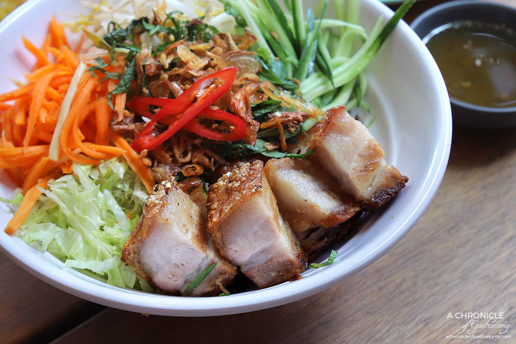 Ms Kim HWKR - Vermicelli noodles salad with crispy roast pork, bean sprouts, cucumber, iceberg lettuce, mixed mint, fried shallots, fried garlic, pickled carrot, Special Dressing ($15.80)