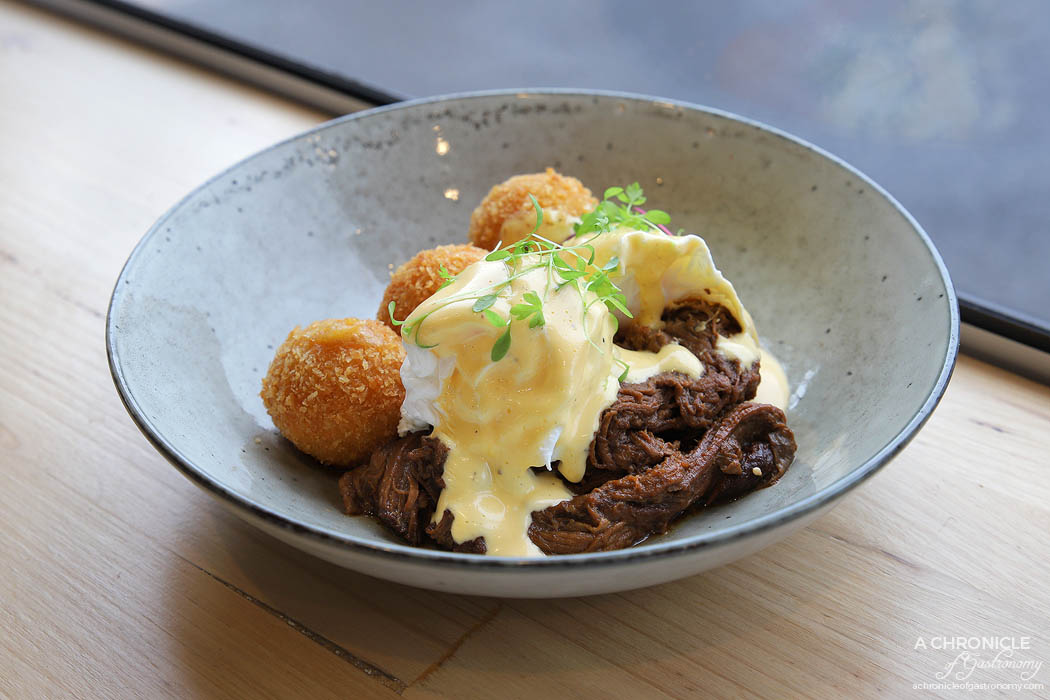 Touchstone - Smoked beef brisket benny w potato, chorizo & cheddar croquette, poached eggs and hollandaise ($19)